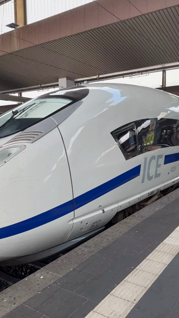 White ICE high speed train with blue striping