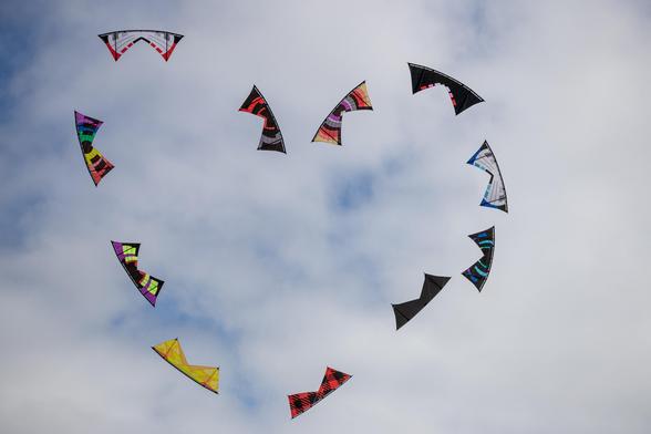 Quad line kites in a heart formation