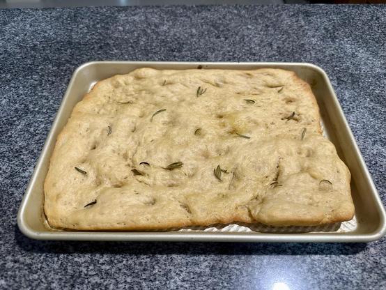 Focaccia on a baking pan. 