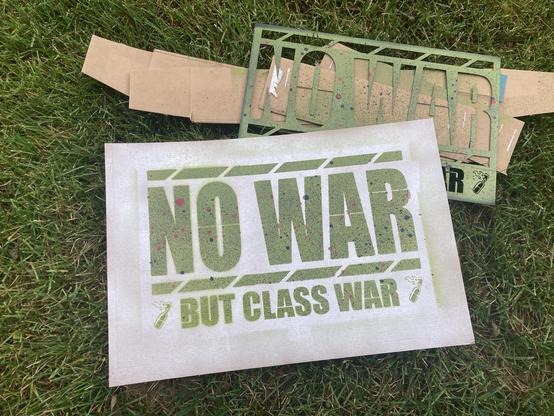 A spray-painted sign made with a 3D printed stencil.