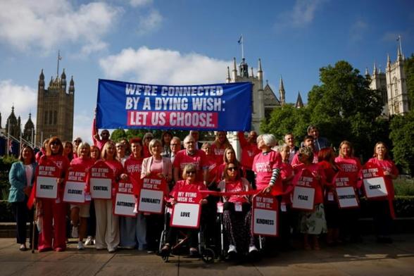 An AFP-credited photograph  of pro-euthanasia campaigners making their voices heard outside UK parliament.