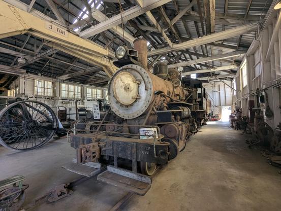 A steam locomotive in a shop