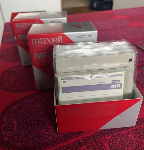 Three boxes of Maxell MF2-DD floppy disks
