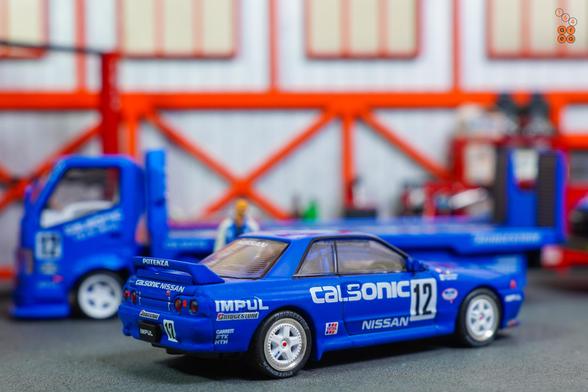 A right side of Nissan Skyline GT-R R32, JTC 1990 on Calsonic livery in 1:64 scale with 1:64 figure on AREA 164