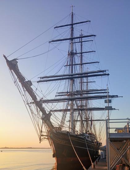 Bow shot of the tall ship Stad Amsterdam tied up on a calm sunny morning.