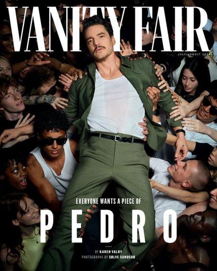 Cover of Vanity Fair with Pedro Pascal on it: He's in a dark green suit with a white t-shirt. He's crowd surfing and people are carrying him on their hands while simultaneously grabbing him because they are fans. Basically everybody wants a piece of Pedro Pascal.