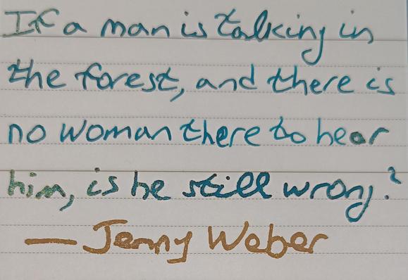 Picture of a quote and authors name in two different inks.
