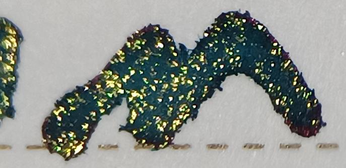 Macro lens shot of a letter 'M' from the quote.