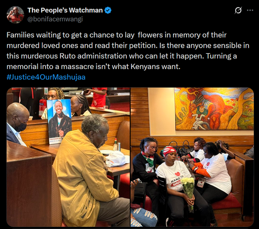 The image is a screenshot of a Twitter post by "The People's Watchman" ([@]bonifacemwangi). The post includes a caption and two photographs. The caption reads: "Families waiting to get a chance to lay flowers in memory of their murdered loved ones and read their petition. Is there anyone sensible in this murderous Ruto administration who can let it happen. Turning a memorial into a massacre isn’t what Kenyans want. #Justice4OurMashujaa."

The first photograph shows an older man in a tan jacket sitting in a booth, looking down, with a framed photograph of a man in the background. The second photograph shows a group of people, including women wearing white shirts with the text "MAMA YA SHUJAA" and holding a bouquet of white flowers. They are seated in a booth, with a colorful painting on the wall behind them. The setting appears to be a public space, possibly a restaurant or a waiting area.
