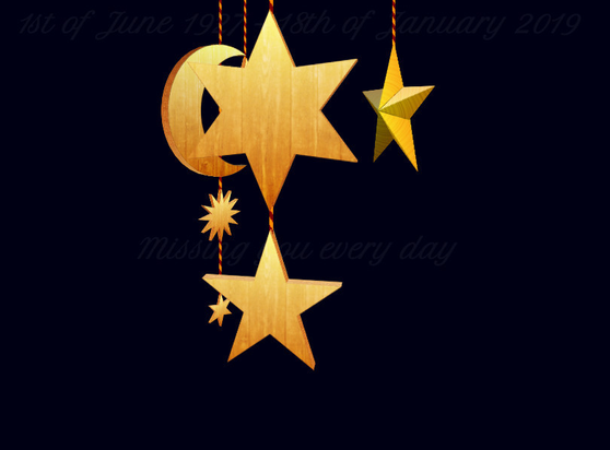 Musical toy with wooden and metallic stars (and a wooden moon) hanging on strings from the top and rotating around a central axis.