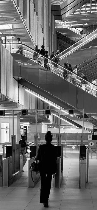 Mirror escalators with wooden structures making an impact on a metro area 