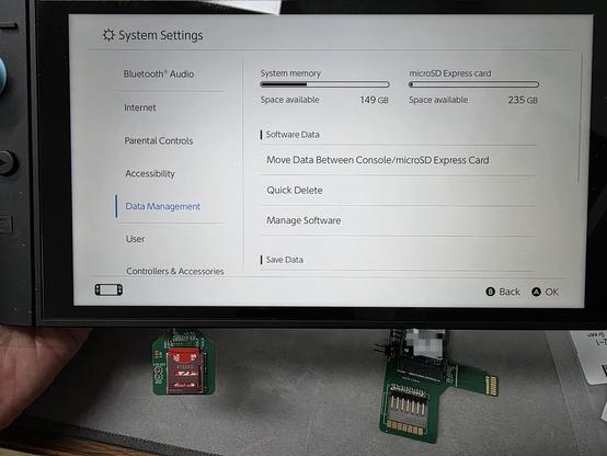 A Micro SD Express card inserted into a Switch 2 via an adapter, the Switch OS recognizes and uses the card correctly.