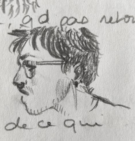 Pencil sketch on notes. Side of a face. The person have short hair, a bit of facial hair, a septum and glasses