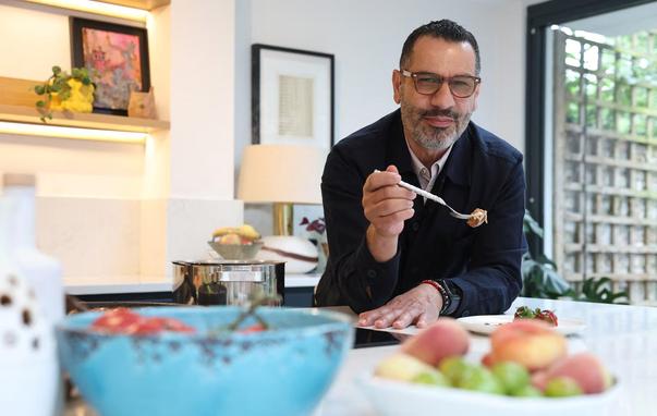Palestinian-British chef, food writer and restaurateur Sami Tamimi poses for a portrait before tasting a dish from his new cookbook during an interview with Reuters at his home in London, Britain, June 3, 2025. REUTERS/Toby Melville
