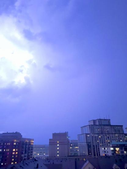 A bright blue-white light illuminates the clouds above the Courthouse neighborhood of Arlington VA