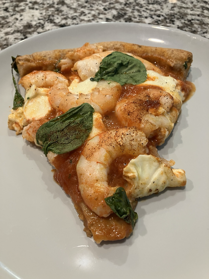 Front of sliced shrimp pizza