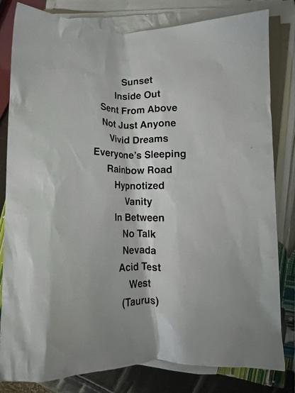 Musical setlist for River Tiber show tonight. A printed sheet featuring a list of song titles or concepts, including "Sunset," "Inside Out," "Vivid Dreams," and "West (Taurus)," among others. The paper is slightly wrinkled and is placed atop the other 200 setlists I have collected over time.