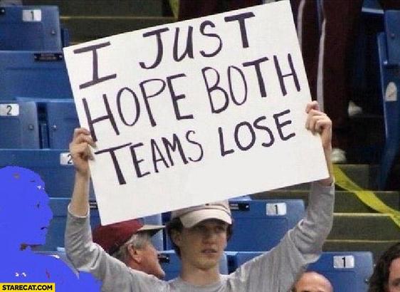 Man holding a sign that says "I just hope both teams lose"