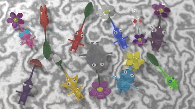 Gummy, T-posed pikmin scattered on a marble table.