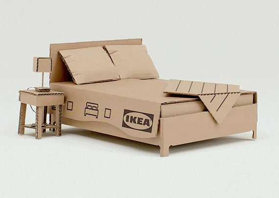 Double IKEA bed, made entirely from brown cardboard boxes.