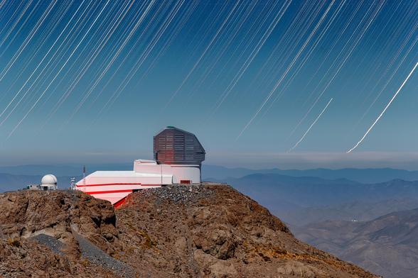 Star trails are seen over NSF–DOE Vera C. Rubin Observatory in this timelapse image captured during First Look observation activities in April 2025.