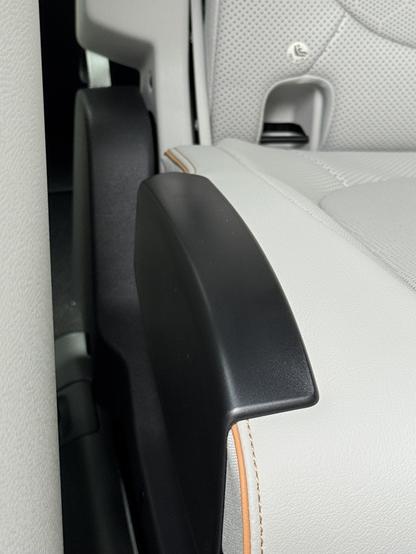 Photograph of black plastic trim added to rear seats in ID.Buzz
