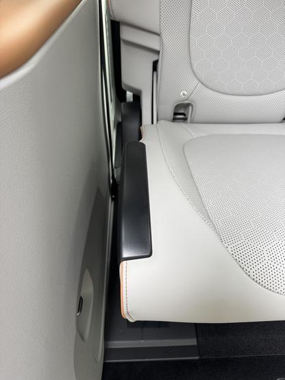 Photograph of black plastic trim added to rear seats in ID.Buzz
