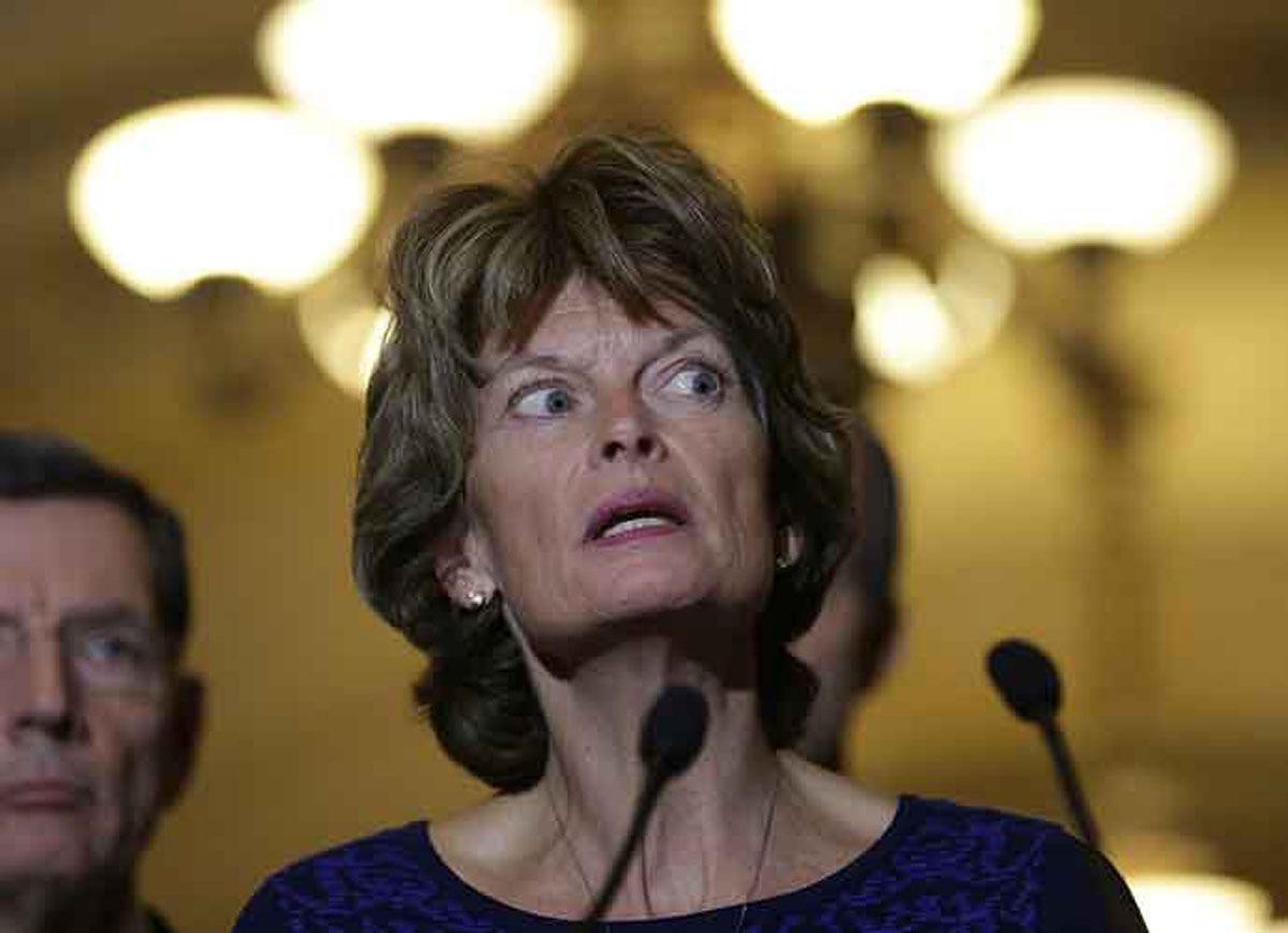 Image of Senator Murkowski telling reporters it was someone else that farted