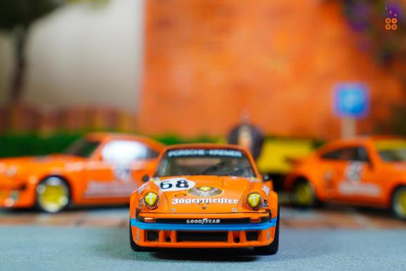 A front side of Porsche 934, 24h Le Mans 1978 on Jägermeister livery in 1:64 scale on AREA 164