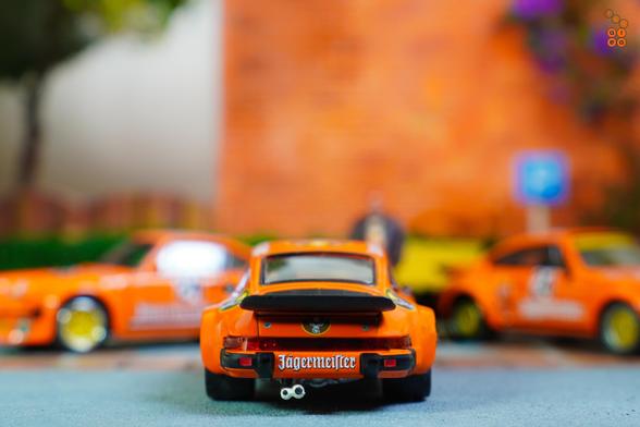 A rear side of Porsche 934, 24h Le Mans 1978 on Jägermeister livery in 1:64 scale on AREA 164