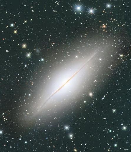 A spiral galaxy viewed edge-on that very much resemble Messier 104, a.k.a the Sombrero Galaxy