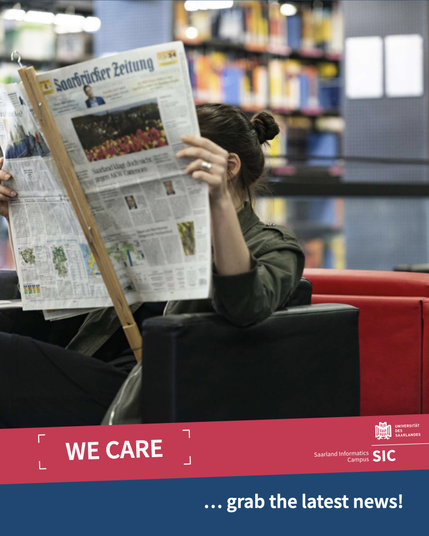 A woman reading a newspaper in the campus library.