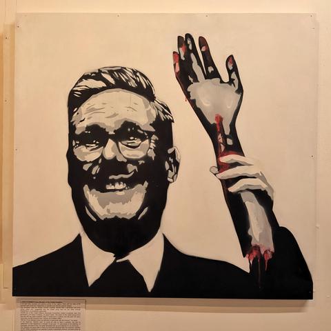 Starmer with a dismembered arm.

Art against genocide. 