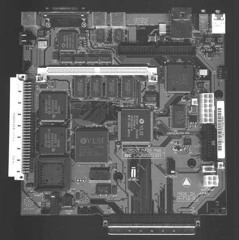 A grayscale scan of a fully populated motherboard from a DuoDock.