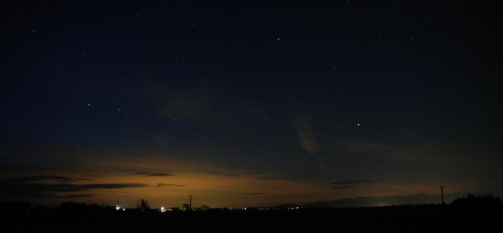 ISO400, 30s exposure broadly reproducing the dark-adapted, visual scene of 'imported' light pollution from far afield affecting north Wales. The Eryri range is clearly seen as silhouetted by reflected light pollution whilst the reflected lights of Liverpool and NW England dominated the left of the image.