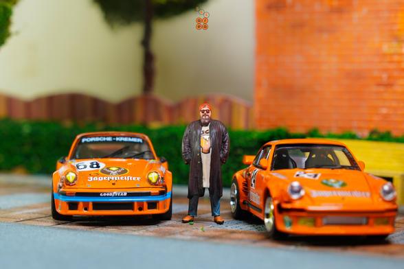 A Porsche 934, 24h Le Mans 1978 on Jägermeister livery by Minichamps in 1:64 scale with 1:64 figure on AREA 164