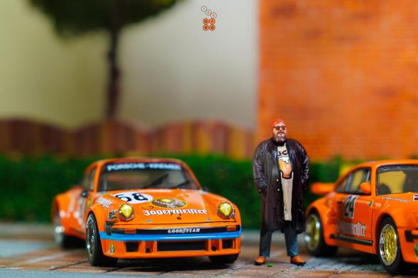 A Porsche 934, 24h Le Mans 1978 on Jägermeister livery by Minichamps in 1:64 scale with 1:64 figure on AREA 164