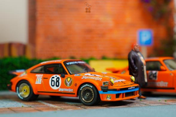 A Porsche 934, 24h Le Mans 1978 on Jägermeister livery by Minichamps in 1:64 scale with 1:64 figure on AREA 164