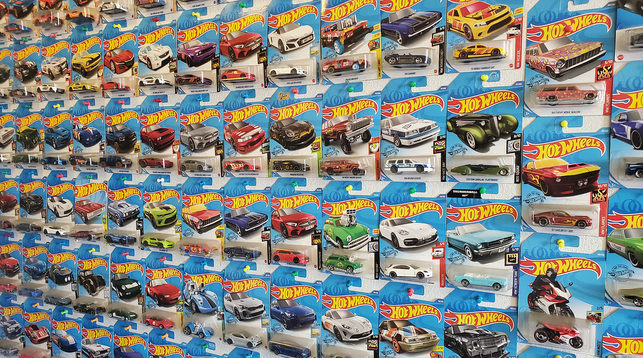 Close-up shot of the wall of Hot Wheels toy cars.