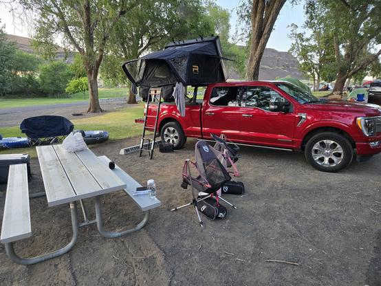 Ford F150 with roof top tent setup camp site.