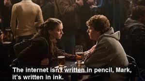 A scene from The Social Network in a bar featuring two characters engaged in a serious conversation. One character, a woman, speaks to a man, emphasizing the permanence of information on the internet. Glasses of beer are on the table, and the background is filled with people.  "The internet isn't written in pencil, Mark, it's written in ink. 