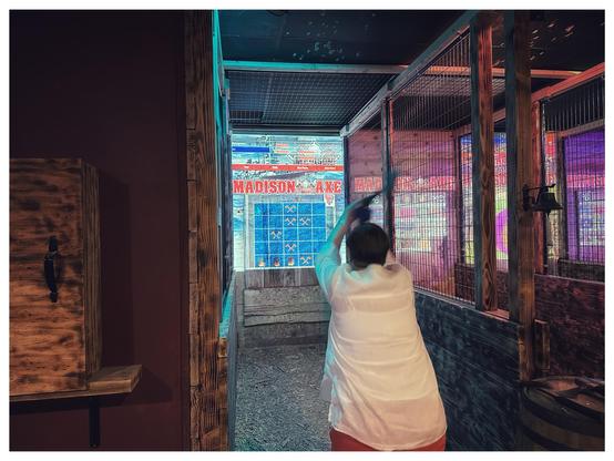 My mother in law throwing an axe at a Battleship board. 