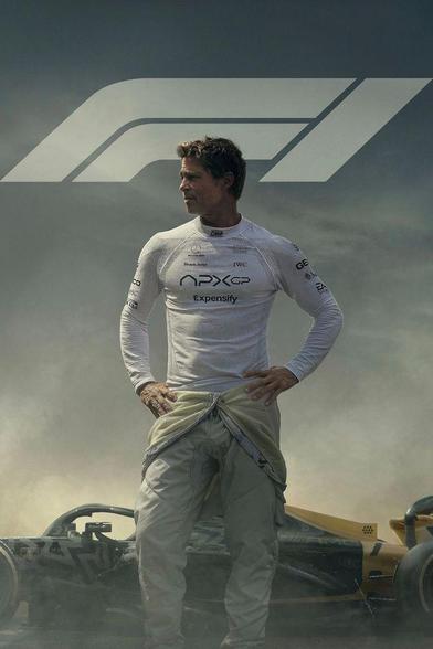 The image depicts a person standing confidently with hands on hips, wearing a white racing suit adorned with various sponsor logos such as APXGP, Mercedes, and Shark Ninja. In the background, there is a Formula 1 car with a yellow and black color scheme, partially covered in smoke, and a large stylized "F1" logo is overlaid on the upper part of the image. The scene suggests a dramatic moment, possibly after a race or a crash.
