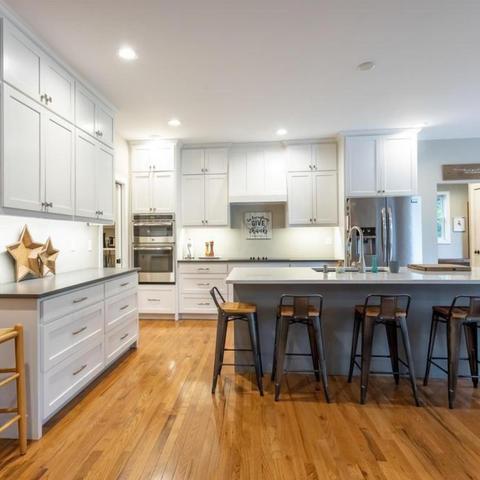 white kitchen with wood floors