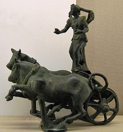 Sculpture group of Selene, the Moon Goddess, in Her chariot drawn by bulls across the sky. She has a cloak billowing behind her and used to hold the reins and probably a riding crop.