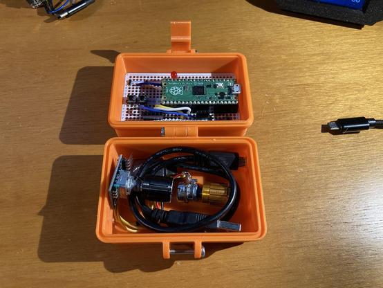 A protoboard with a controller in a 3D printed rugged box.