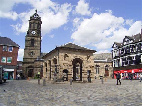 View of historic Pontefract Buttercross market in main square of town, with church of St Giles in the background. 