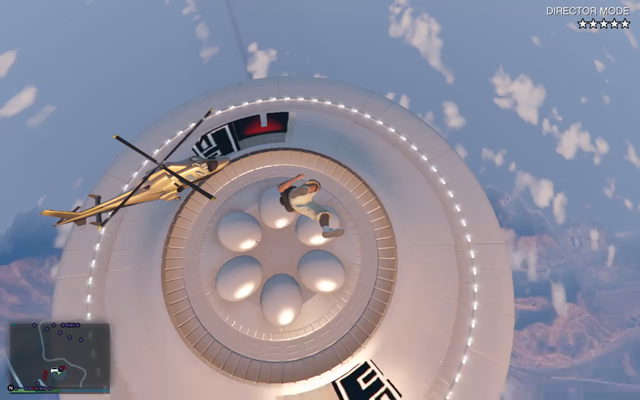 As I'm falling supposedly the "shield" of the UFO pushes me away and as I fall part of the props/roads I placed in the sky become visible.

I tried to build as high as I could but the UFO in Sandy Shores it does not allow you to build up to its height so it becomes a bit more challenging to land on it, even as this is in Director Mode.

I have landed on this UFO multiple times in Story Mode...so I do have that experience as well!