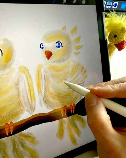 A digital drawing of a yellow bird on an iPad.