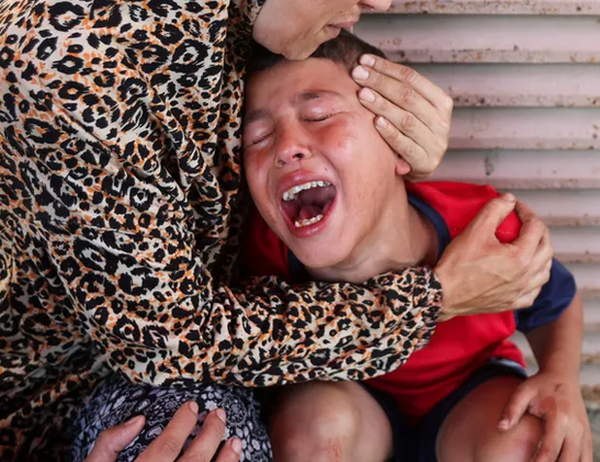 A mother and a child, suffering in Gaza, Palestine.
Shuhada al-Aqsa Hospital in Deir al-Balah, today. Photo: Ramadan Abed/Reuters
